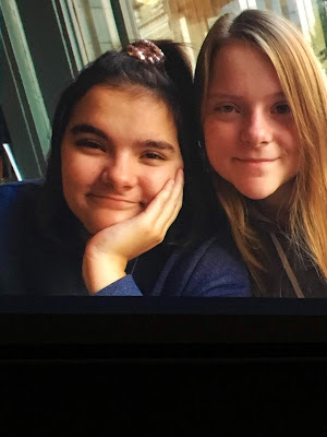 photo of two girls smiling